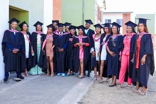 NHTC graduates in academic gowns